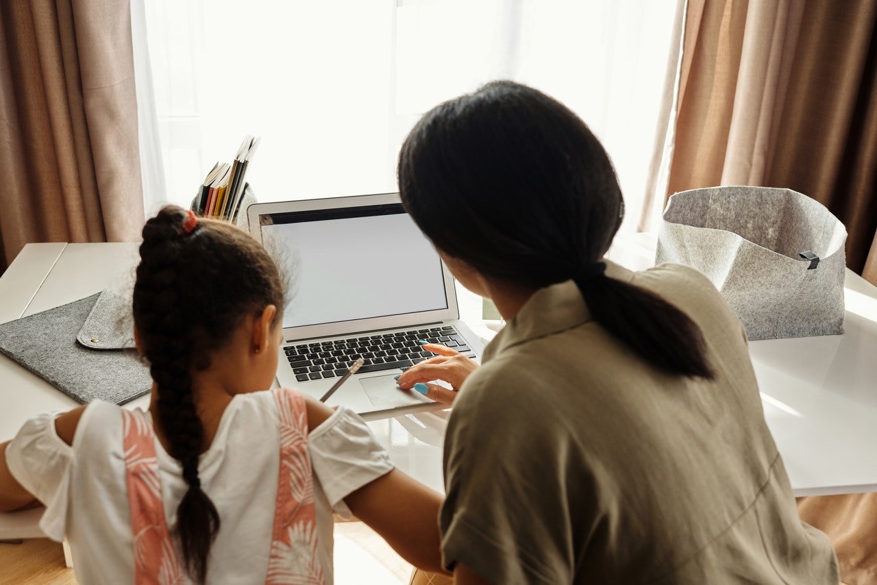 Mother teaching her daughter in homeschool | Spyglass Realty